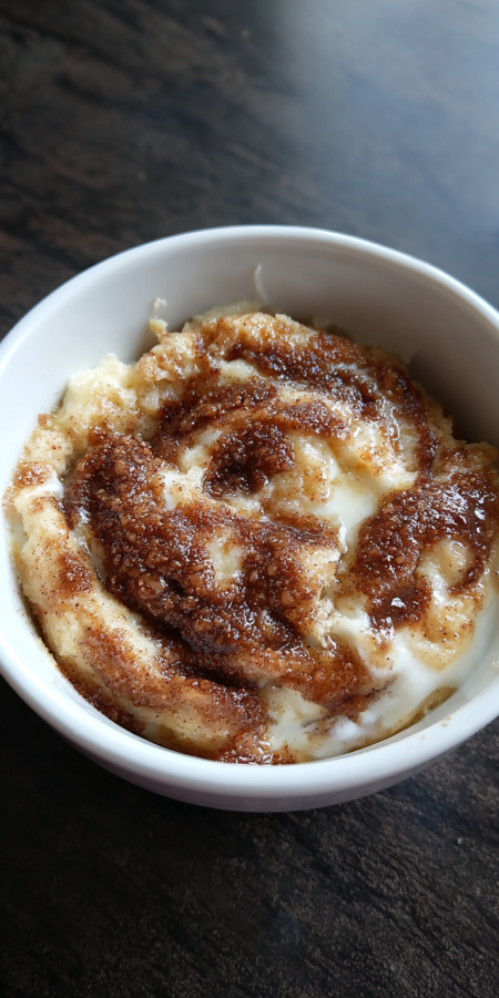 Keto Cinnamon Roll Mug Cake served warm with cozy spices